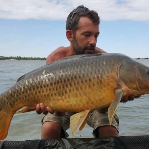 Nice shot of man holding carp