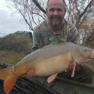 Nice shot of man holding carp