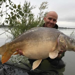 Nice shot of man holding carp