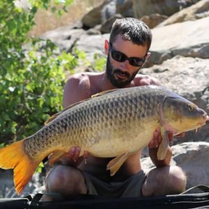 Nice shot of man holding carp
