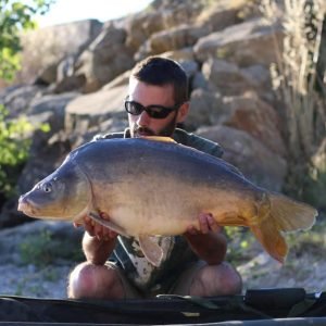 Nice shot of man holding carp