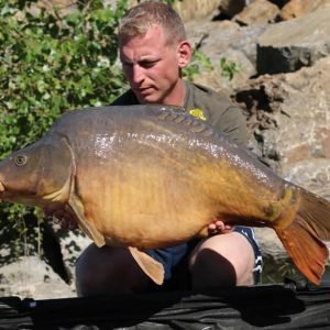 Nice shot of man holding large carp