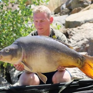 Nice shot of man holding big carp